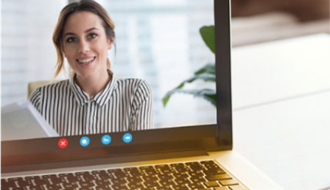 Female clinician smiling on zoom call